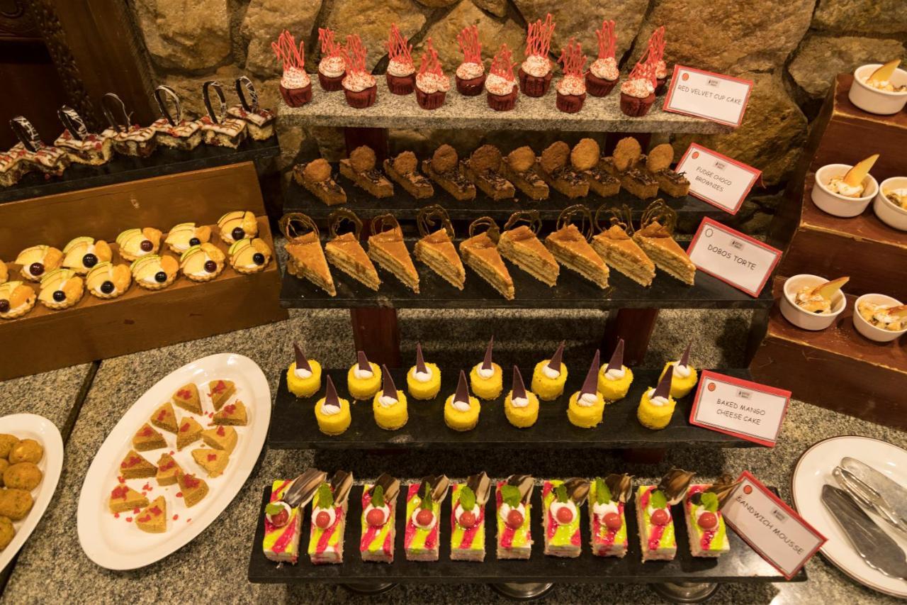 Heritage Madurai Exterior foto A selection of desserts